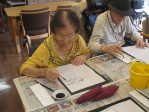 絵手紙と小さい来客者 写真